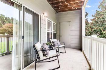 A patio with a table and chairs is shown.